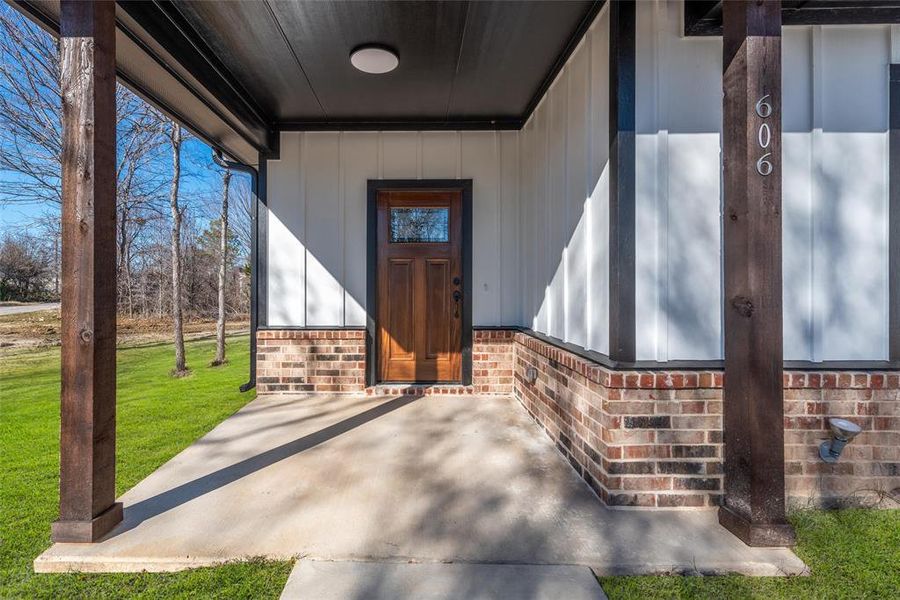 A covered front porch welcomes you to your new home.