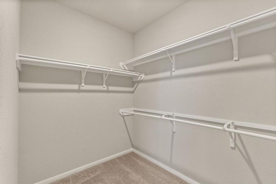 A view of your large primary walk-in Closet