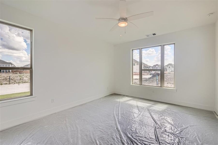 Primary bedroom with ceiling fan