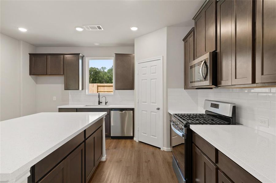 This kitchen is not only a functional space but also has ample storage. Whether you're a seasoned chef or just love to gather and enjoy good food, this kitchen is a dream come true.