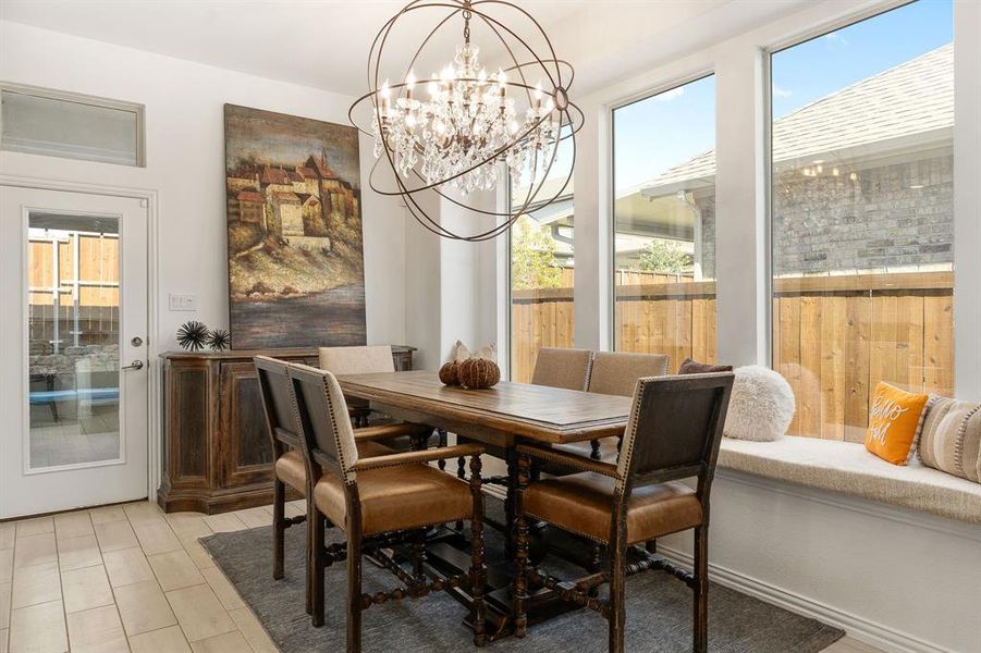 Dining room featuring an inviting chandelier and a wealth of natural light