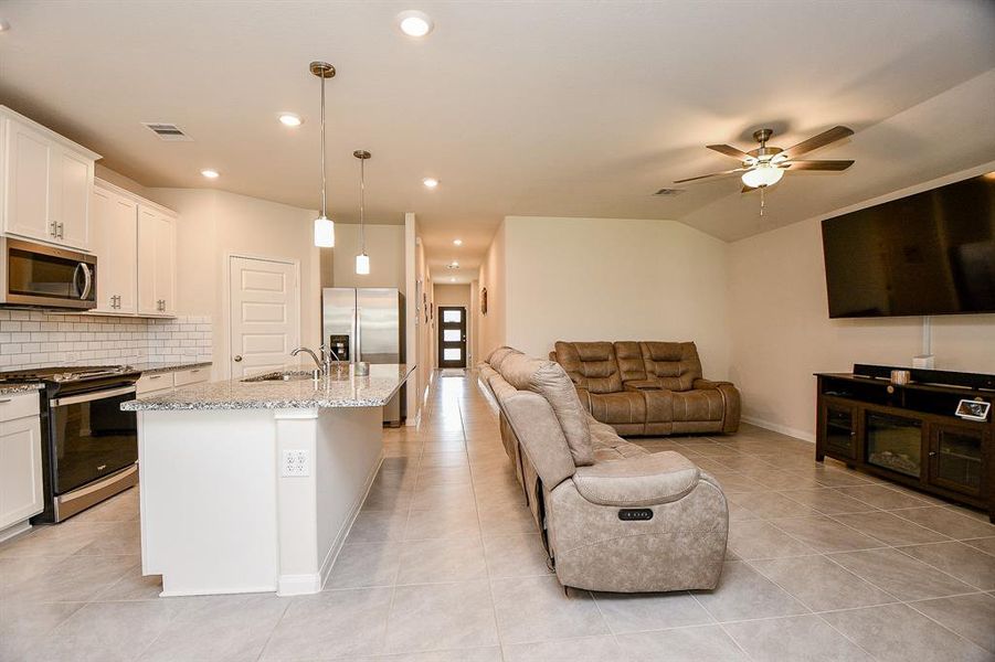 Combined family room and kitchen are great for entertaining.