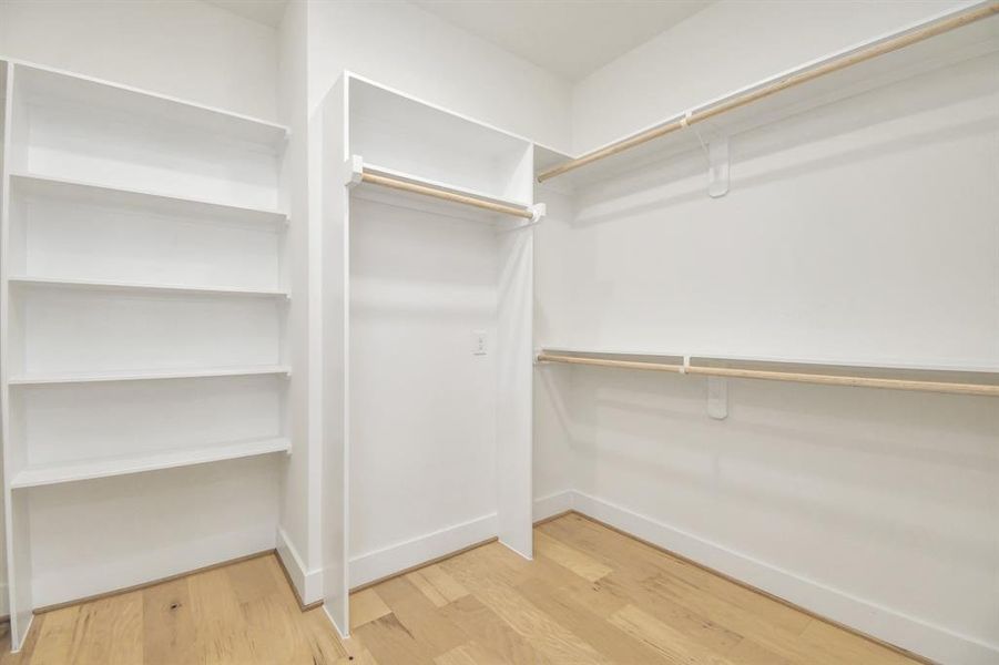 A organizers dream with walk in closet and custom shelve.