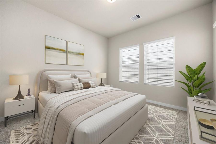 Secondary bedroom features plush carpet, neutral paint, large window and ample closet space.