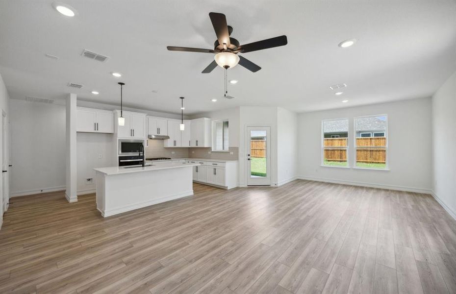 Open concept floor plan throughout *real home pictured