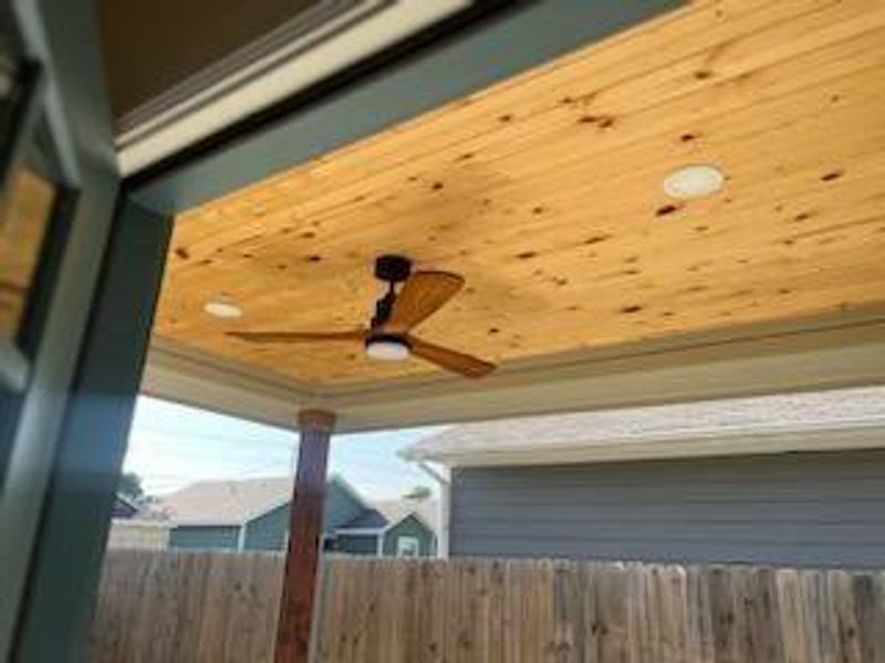 Exterior details with ceiling fan, wood ceiling, and crown molding