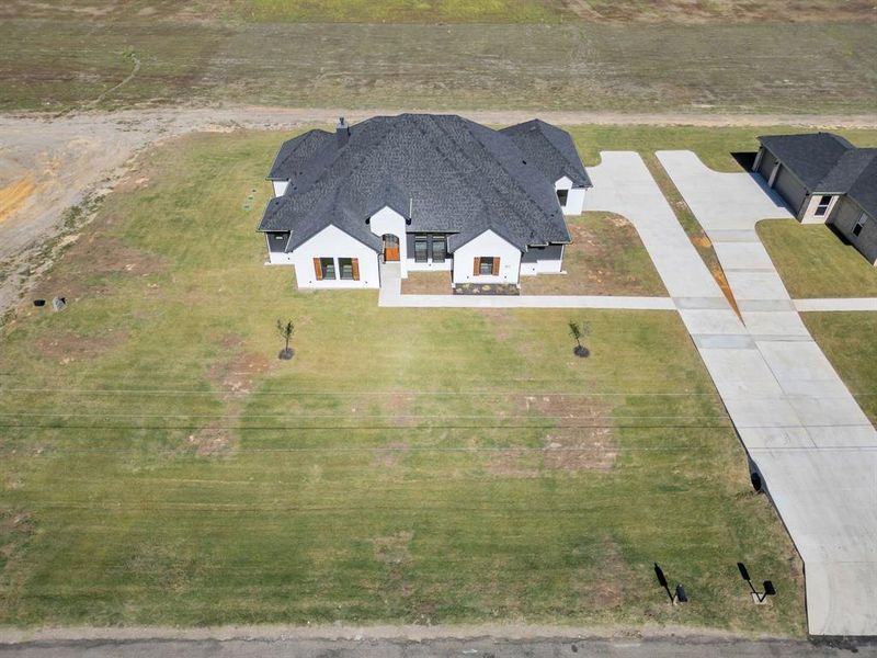 Birds eye view of property featuring a rural view