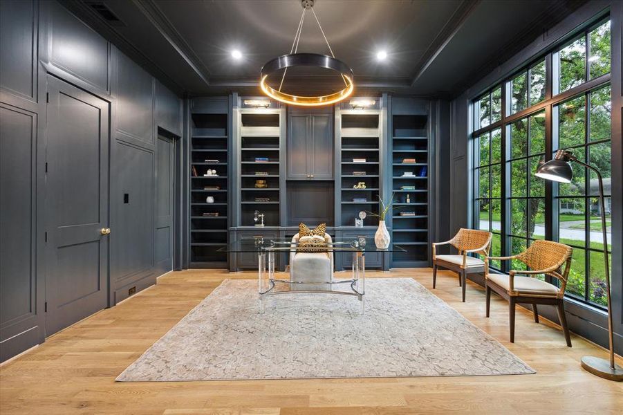 The study that is the right of the entry steals the spotlight Finished in Slate Teal, a marriage of blue and green that exudes drama and decadence. Custom cabinetry, glorious natural light, adjoining full bath and storage closet. It is a must see.