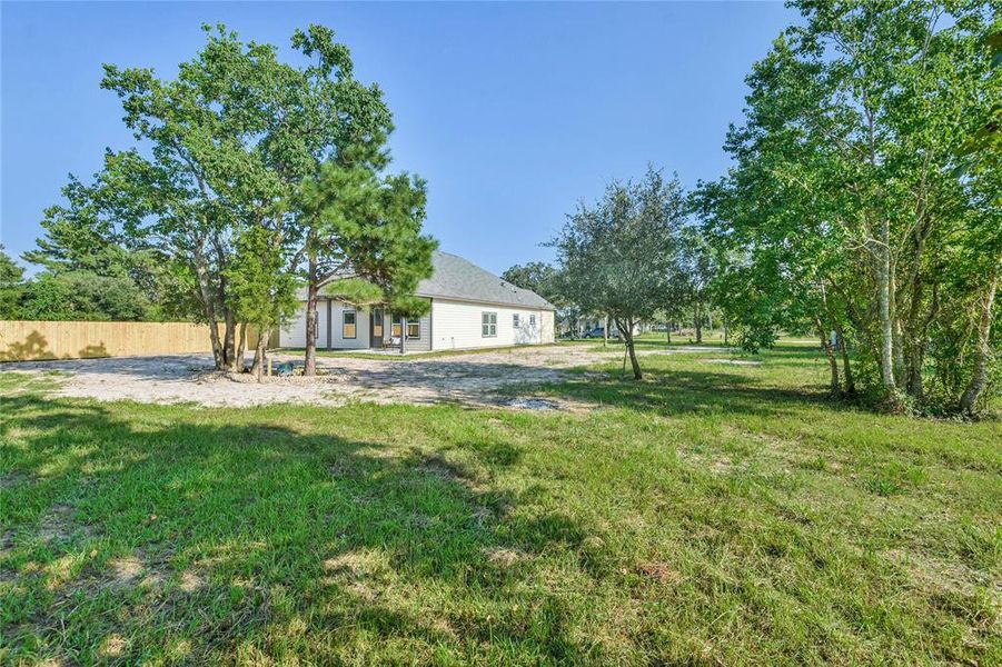 View from back corner of yard-note how much more land there is surrounding the home with limitless potential.