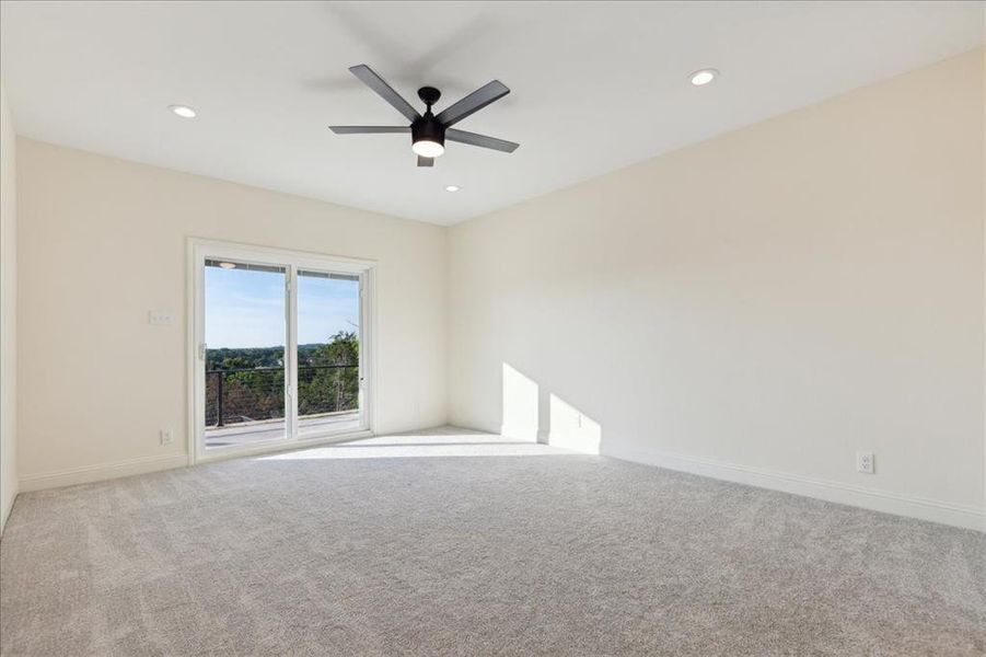 Empty room featuring carpet and ceiling fan