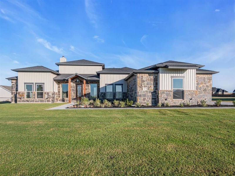 View of front of property with a front lawn