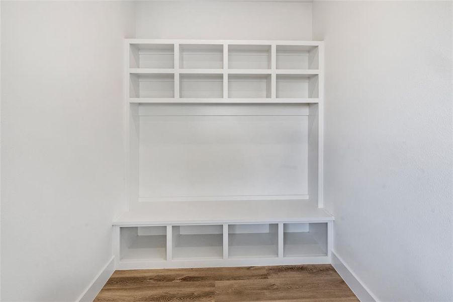 Mudroom with hardwood / wood-style flooring