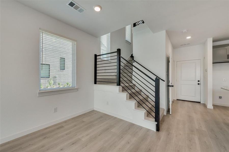 Stairs with light wood-type flooring