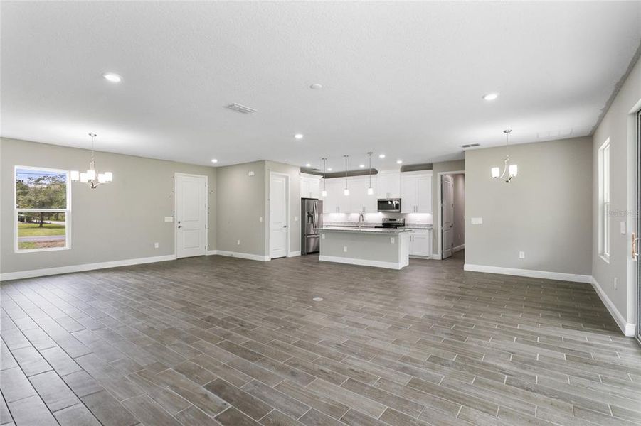 The openness of the living, dining and kitchen paired with an OVERSIZED SLIDING GLASS DOOR that accesses a COVERED LANAI makes gathering with family and entertaining friends a breeze!