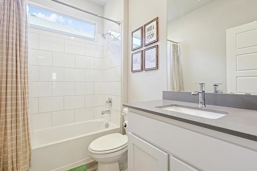 Split Bathroom with undercount sink, crome finishes. quartz countertops and white tile