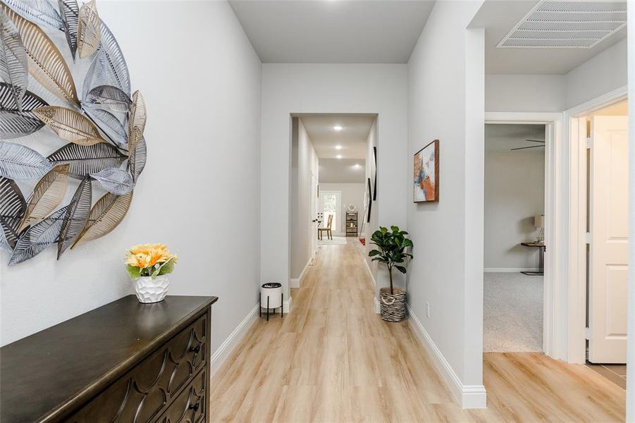 Hallway with light wood-type flooring