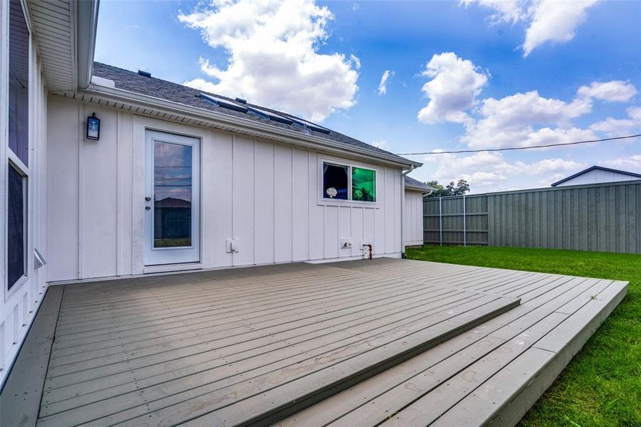 15 foot wide massive deck for friends , family and guests.   Please notice ... ALL New windows, new doors, brand new roof with the entire roof line expanded and new pitches created to enhance its beauty. The 8 foot privacy fence in the HUGE back yard means quiet enjoyment.