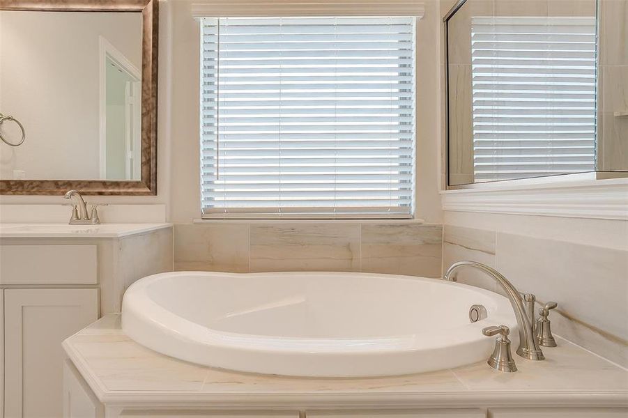 Bathroom featuring sink and a tub