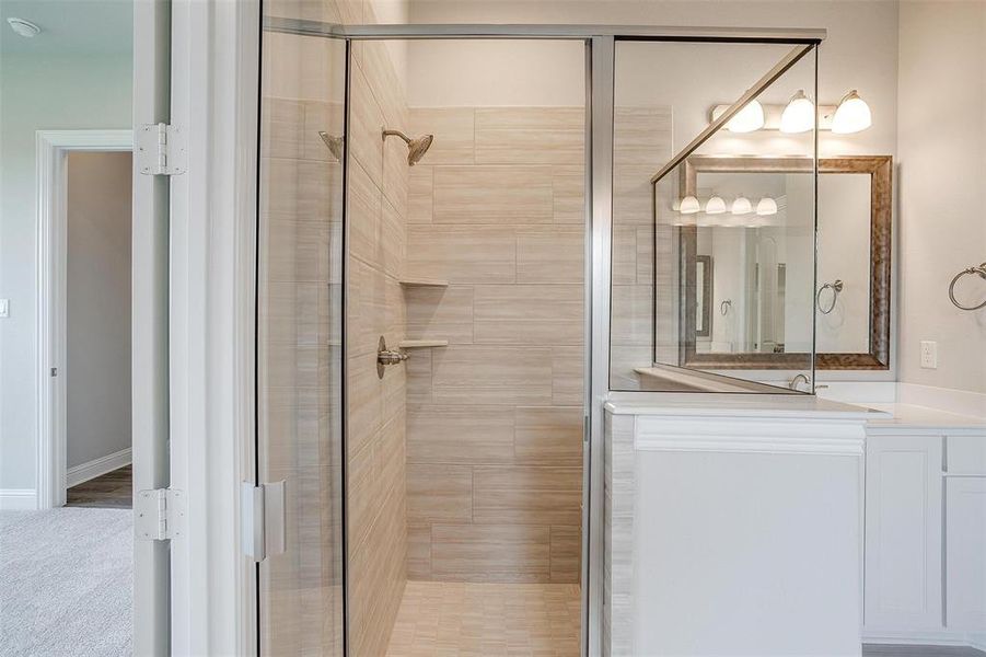 Bathroom featuring a shower with shower door