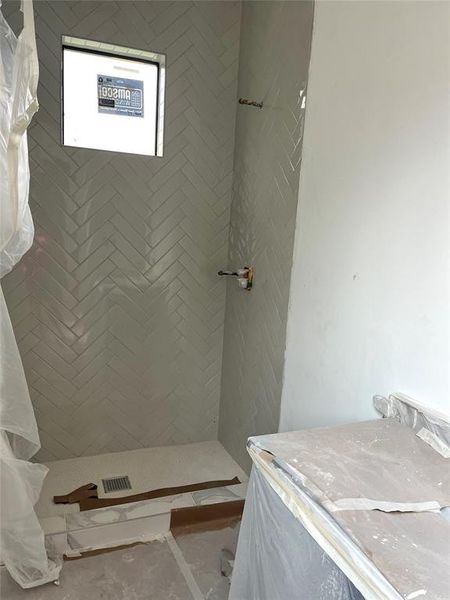 Secondary bathroom - walk-in shower with beautiful stones!