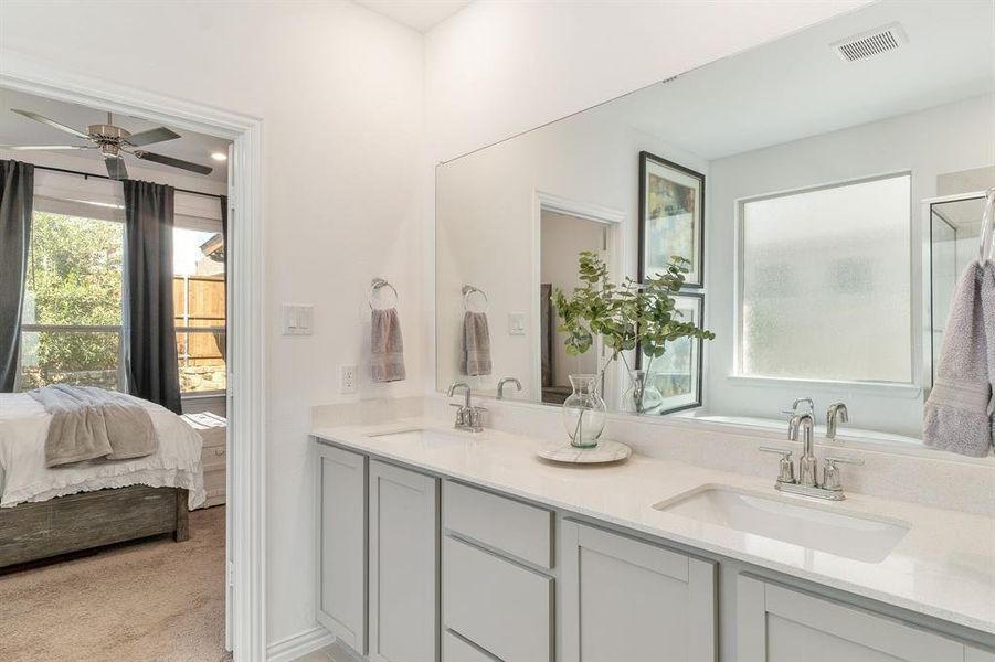 Bathroom with vanity and ceiling fan