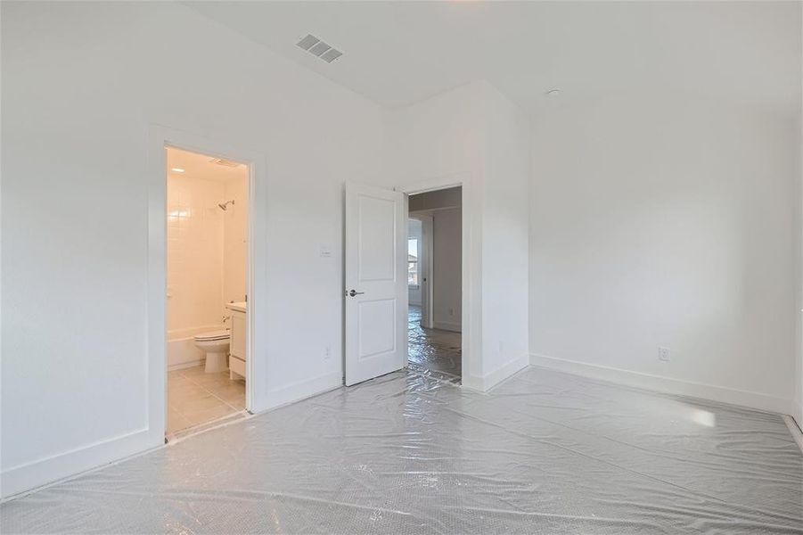 Bedroom featuring connected bathroom