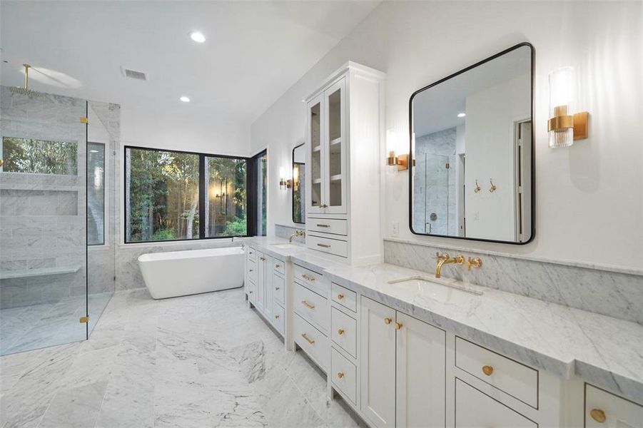 Primary bathroom featuring Italian Carrea throughout and Newport Brass plumbing fixtures.