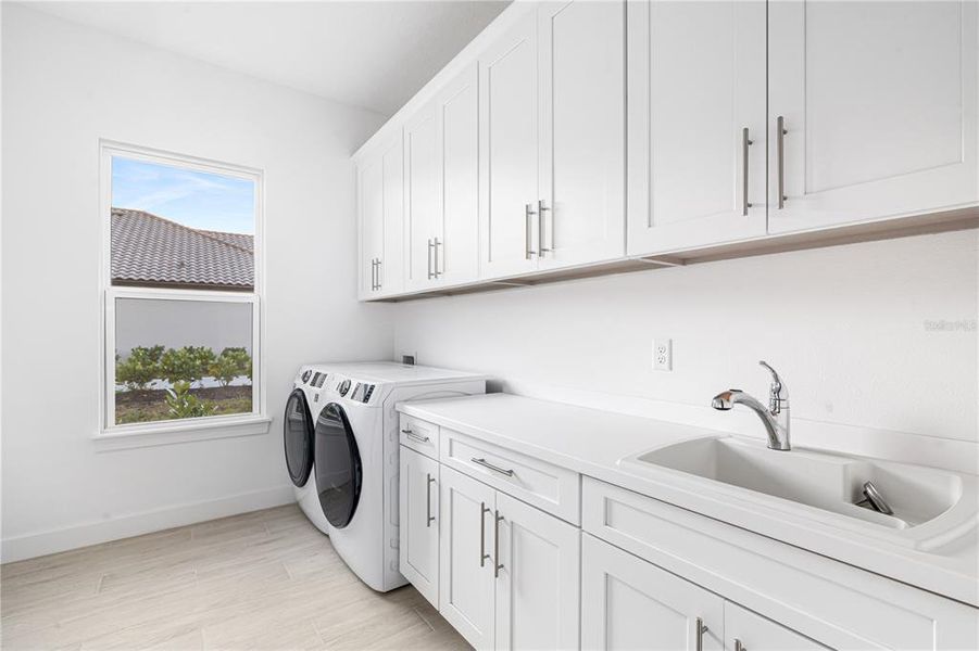 Large Laundry room with included washer and dryer