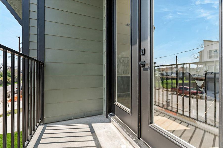 MODEL UNIT BALCONY EXAMPLE-A covered balcony—a necessity for Houston's summers—provides the perfect escape, offering shade and comfort while enjoying outdoor gatherings and leisurely moments year-round.