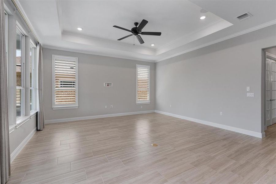 living room w/ large windows, ceiling fan