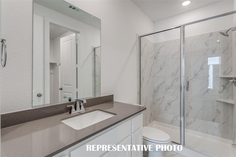 Guests will love getting ready in any of the gorgeous guest baths featured in this outstanding home!  REPRESENTATIVE PHOTO