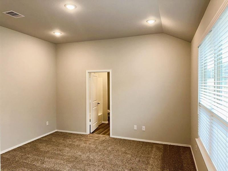 Master bedroom has a soaring vaulted ceiling!