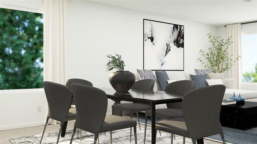 Dining room with light hardwood / wood-style flooring