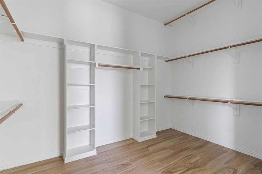 Walk in closet featuring light hardwood / wood-style floors