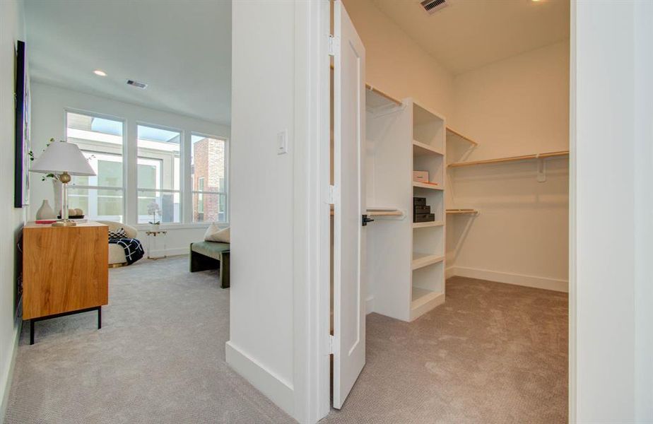 Primary suite with a large walk-in closet