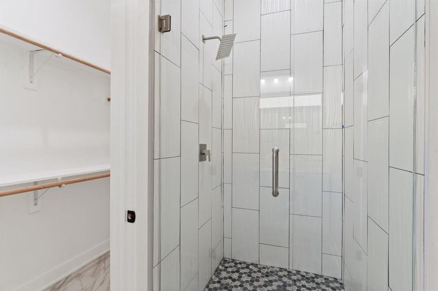 Bathroom with a shower with door