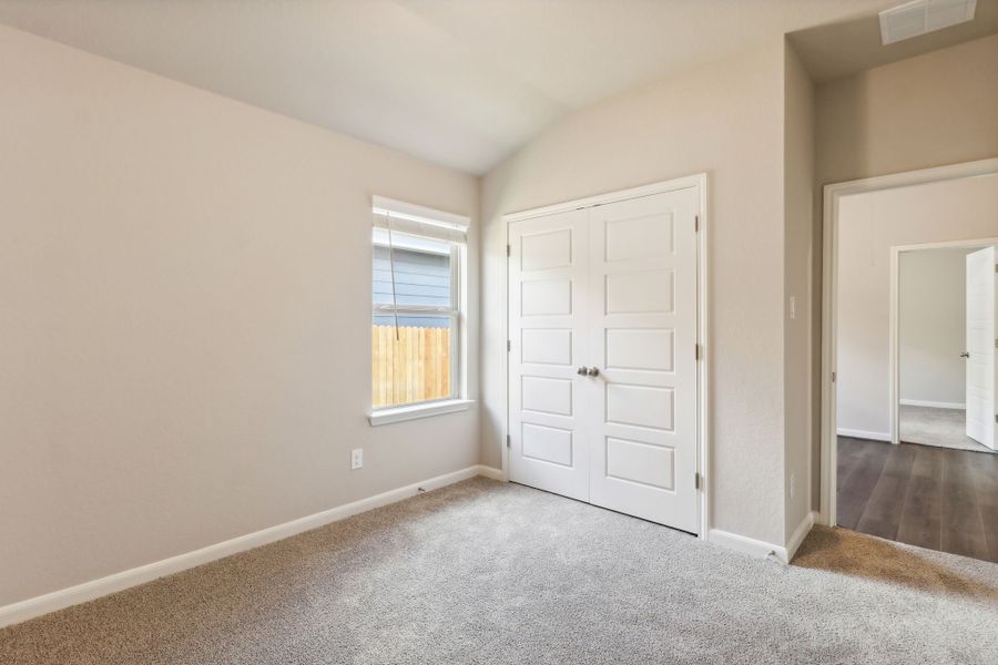 Guest bedroom in the Hughes floorplan at a Meritage Homes community.