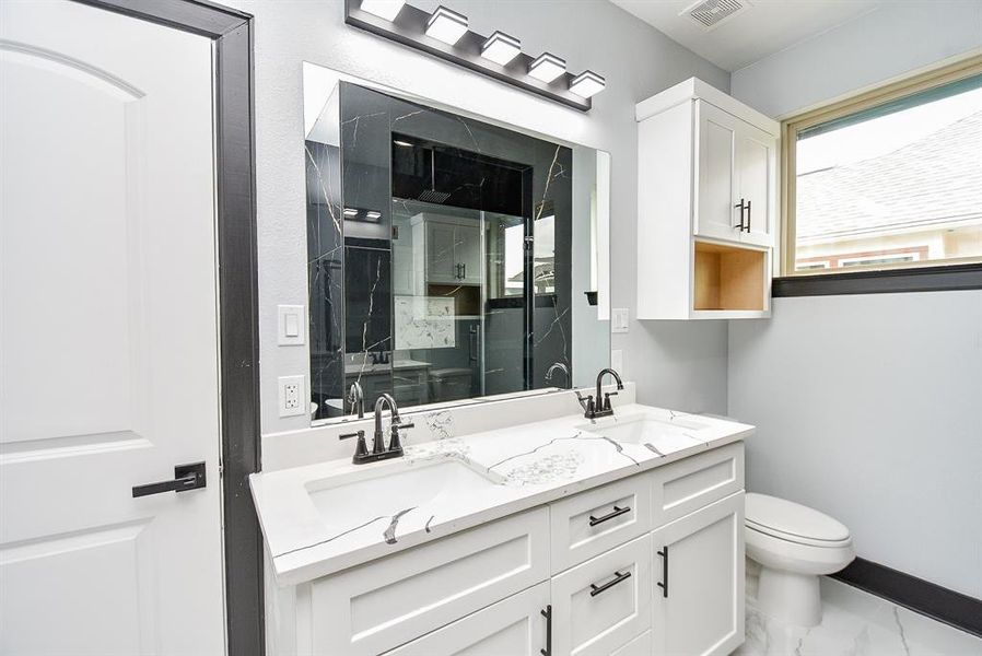 Alongside double sinks, the primary bathroom includes quartz countertops for an extra touch of style.