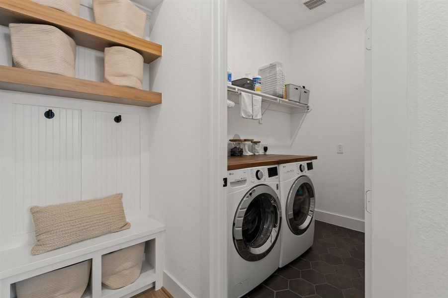 The laundry room is spacious to be able to take care of all of your laundry needs.
