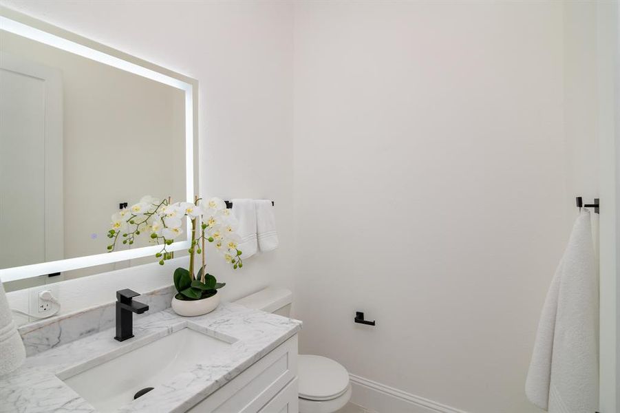 Bathroom featuring vanity and toilet