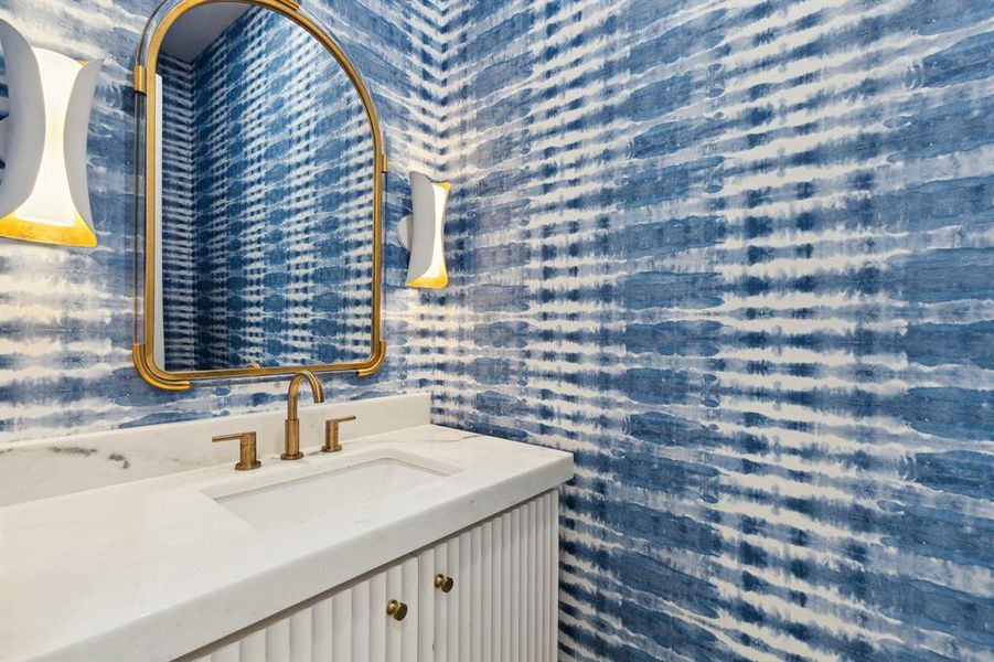 Bathroom with vanity and high end wall paper