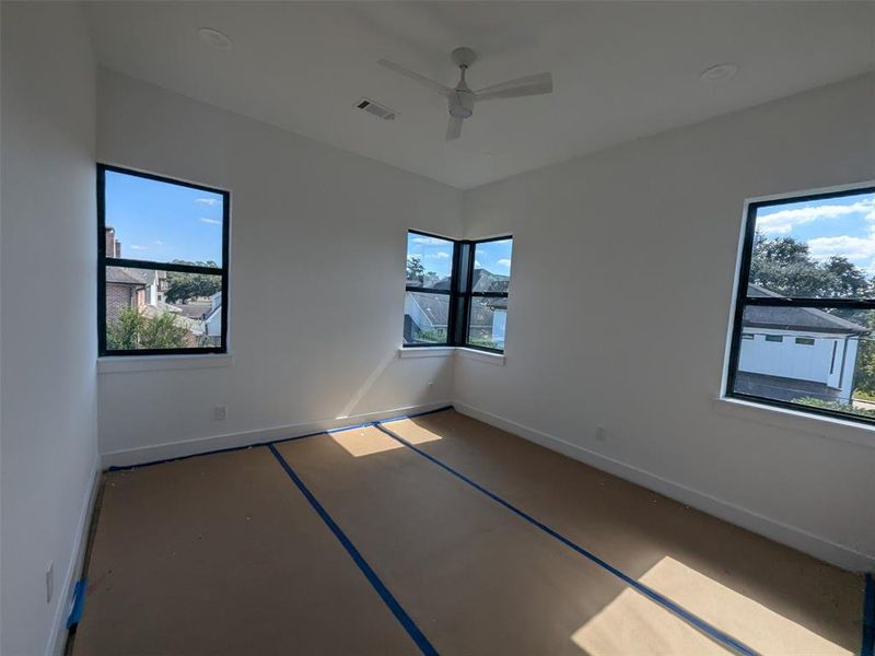 Secondary Bedroom with corner windows.