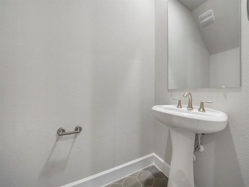 The downstairs Powder Bath is conveniently located between the living and dining room! (Sample photo of a completed Sterling Floor Plan. Image may show alternative features/and or upgrades.)