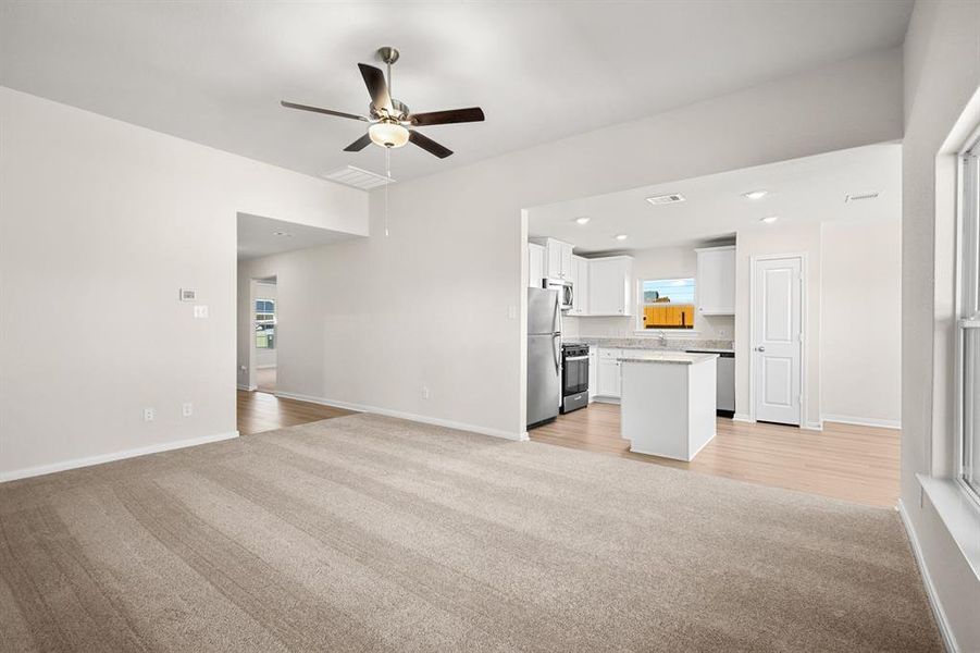 The Living room is spacious and is open towards the kitchen.