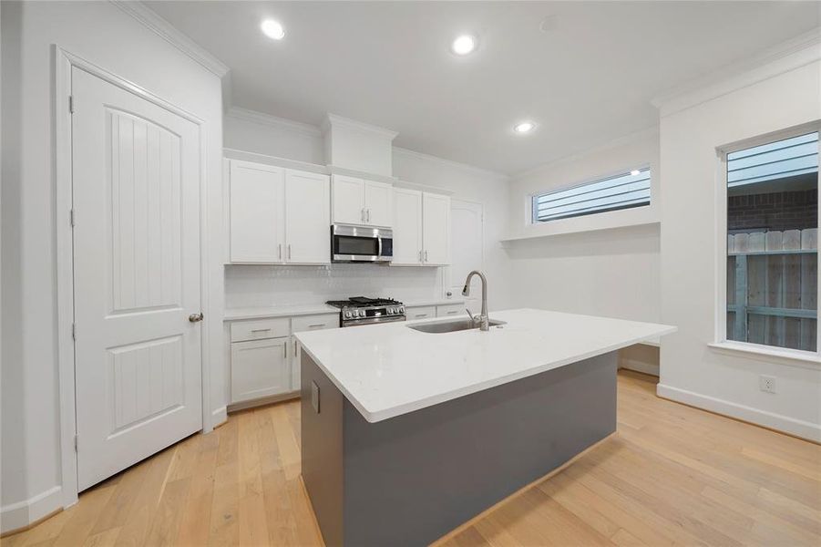 Another view of the beautiful kitchen and mud room! (Sample photos of a completed Chesapeake floor plan. The image may feature alternative selections and/or upgrades.)