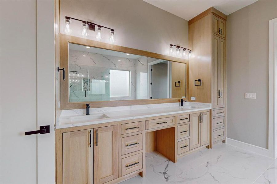 Bathroom featuring vanity and a shower with door