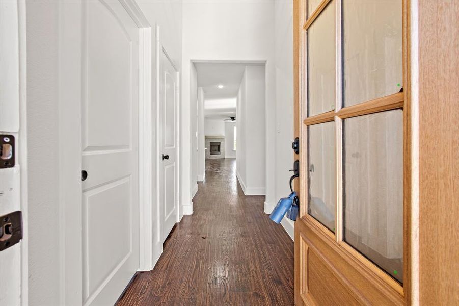 Hallway featuring dark wood-type flooring