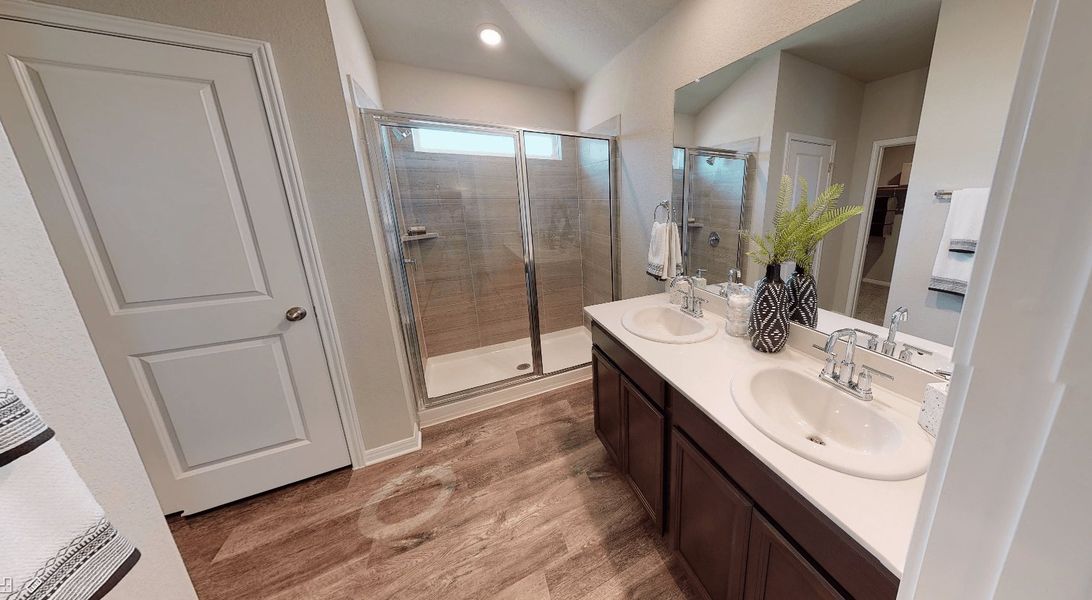 Relax and unwind in the luxurious primary bathroom.