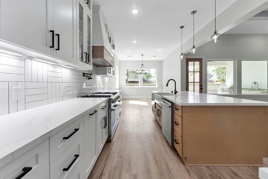 Kitchen with views of the dining area and backyard