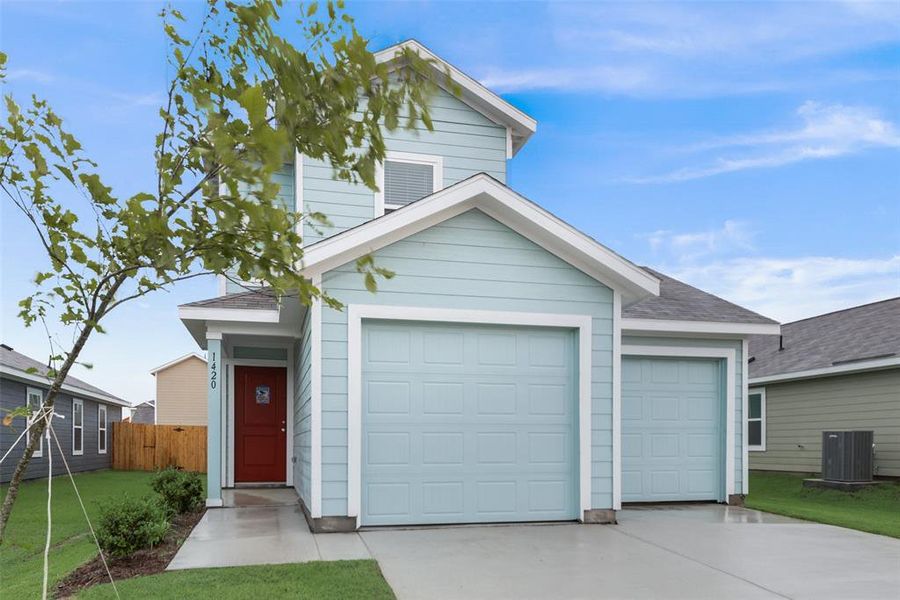 View of front of property with a front yard and central AC